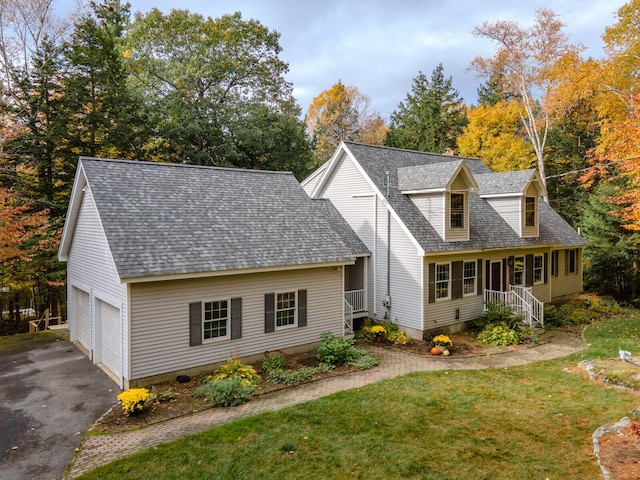 51 Tracy Cove Cir, Rome, ME 04963 - cape cod house with a shingled roof, a front lawn, a garage, and asphalt driveway