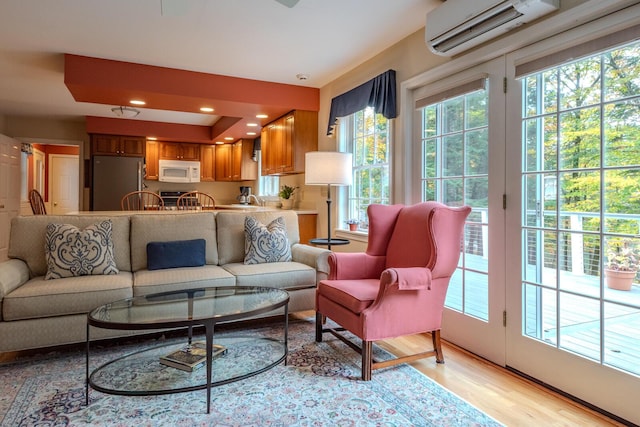 51 Tracy Cove Cir, Rome, ME 04963 - living area featuring a wall mounted AC, light wood-style flooring, and recessed lighting