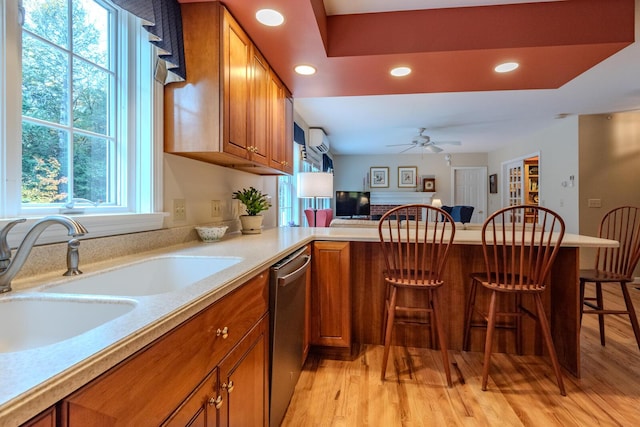 51 Tracy Cove Cir, Rome, ME 04963 - kitchen featuring brown cabinetry, dishwasher, recessed lighting, ceiling fan, and light wood-style floors