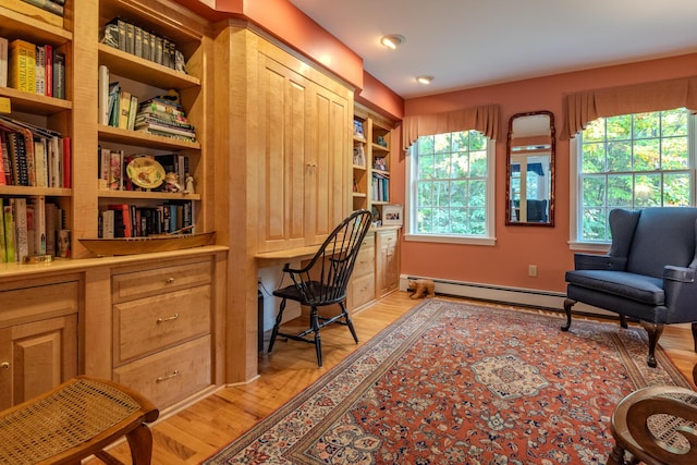 51 Tracy Cove Cir, Rome, ME 04963 - office area with a baseboard heating unit, light wood-type flooring, built in shelves, and built in desk