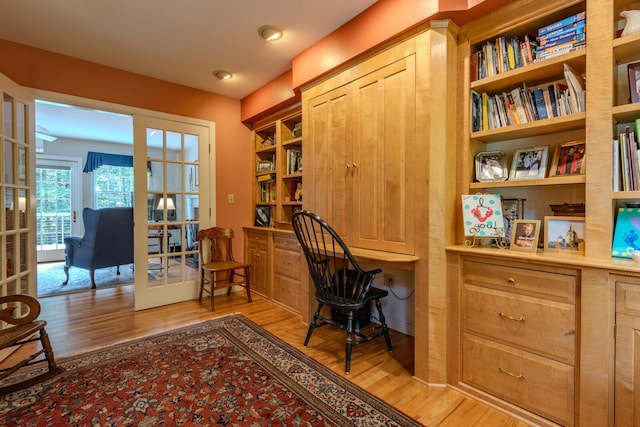 51 Tracy Cove Cir, Rome, ME 04963 - office area featuring french doors, built in study area, and light wood finished floors