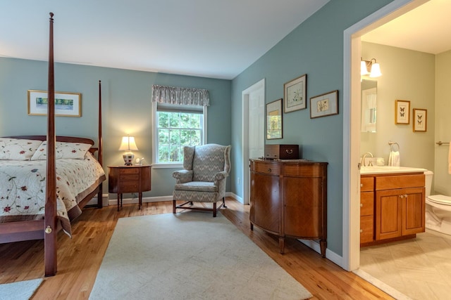 51 Tracy Cove Cir, Rome, ME 04963 - bedroom with light wood-style floors and ensuite bath