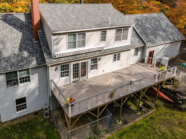 51 Tracy Cove Cir, Rome, ME 04963 - rear view of property featuring a chimney, a shingled roof, and a deck