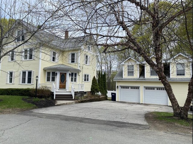 45 Tyler Ave, Bangor, ME 04401 - view of front of property featuring a chimney, asphalt driveway, and an attached garage