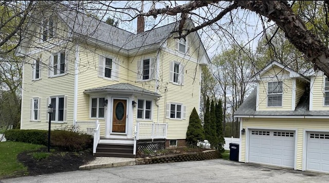45 Tyler Ave, Bangor, ME 04401 - traditional-style home with a chimney and a garage