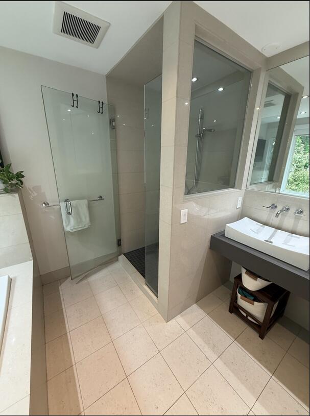 45 Tyler Ave, Bangor, ME 04401 - bathroom with a shower stall and tile patterned floors