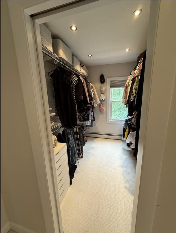 45 Tyler Ave, Bangor, ME 04401 - spacious closet with a baseboard heating unit and carpet flooring