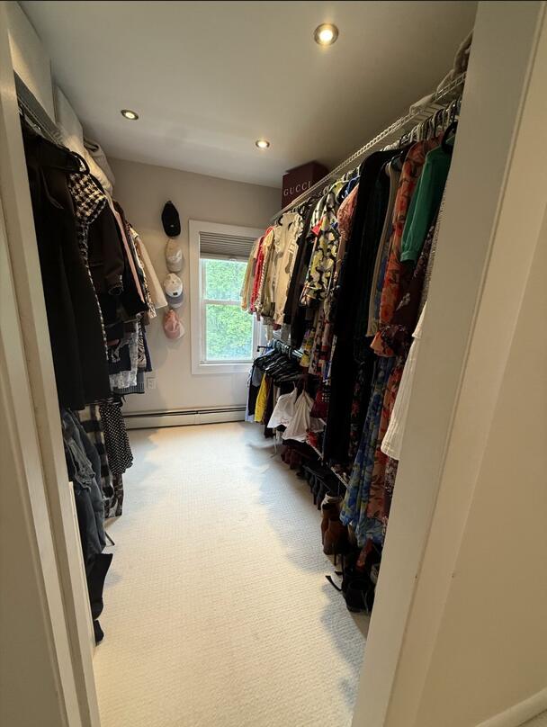 45 Tyler Ave, Bangor, ME 04401 - walk in closet featuring carpet floors and a baseboard heating unit