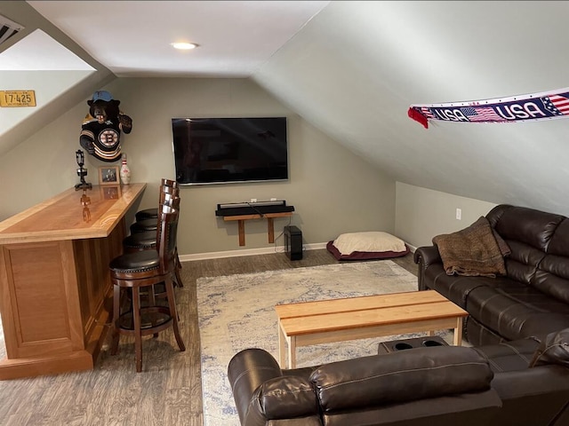 45 Tyler Ave, Bangor, ME 04401 - living area featuring wood finished floors, lofted ceiling, and a bar