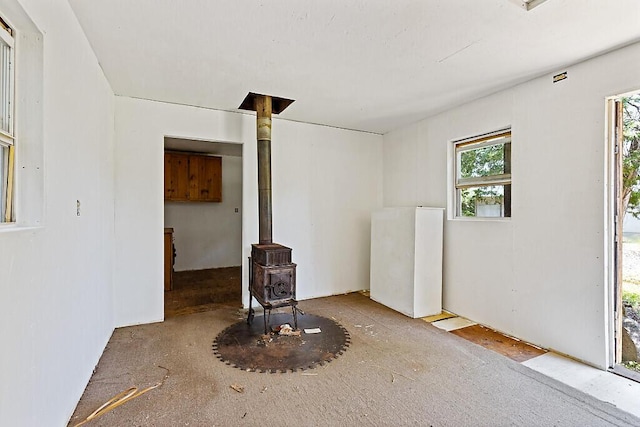 259 Drury Rd, Solon, ME 04979 - empty room featuring a wood stove