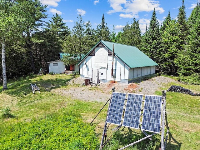 259 Drury Rd, Solon, ME 04979 - view of side of home featuring ground mounted solar panels