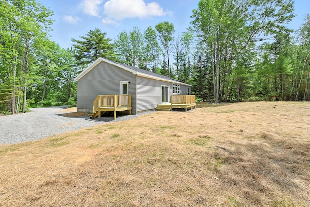 4 Willis Rd, Benton, ME 04901 - view of property exterior with a deck and a lawn