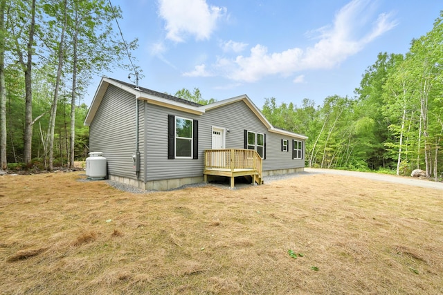 4 Willis Rd, Benton, ME 04901 - rear view of house with a yard