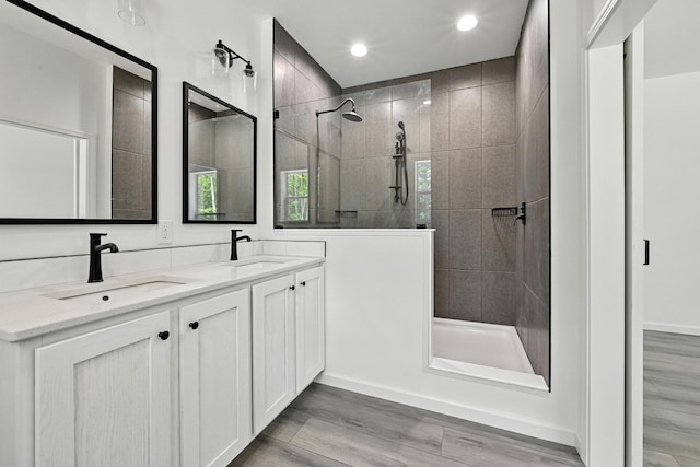 4 Willis Rd, Benton, ME 04901 - full bathroom featuring walk in shower, double vanity, wood finished floors, and recessed lighting