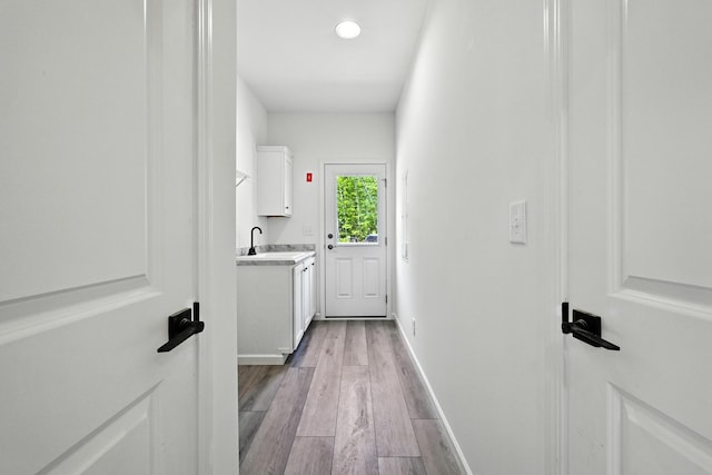 4 Willis Rd, Benton, ME 04901 - laundry area with light wood-style flooring and a sink