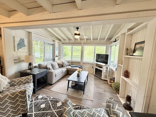 628 Springy Pond Rd, Otis, ME 04605 - living area with wood finished floors, a ceiling fan, and wooden walls