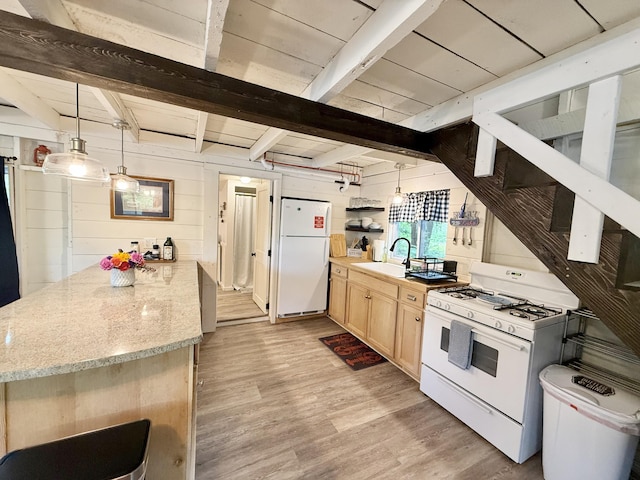 628 Springy Pond Rd, Otis, ME 04605 - kitchen featuring white appliances, light brown cabinetry, light wood finished floors, a peninsula, and beam ceiling