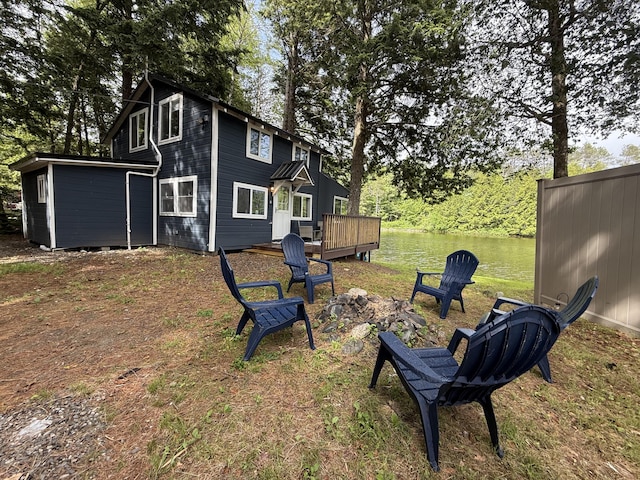 628 Springy Pond Rd, Otis, ME 04605 - view of yard with an outdoor fire pit and a deck with water view