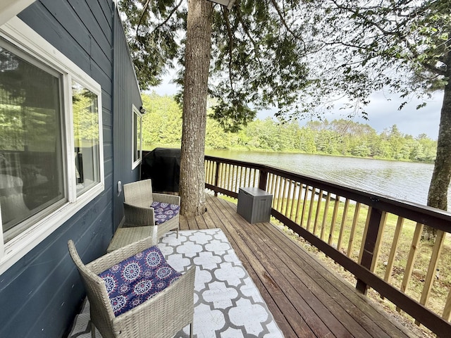 628 Springy Pond Rd, Otis, ME 04605 - wooden terrace with a water view