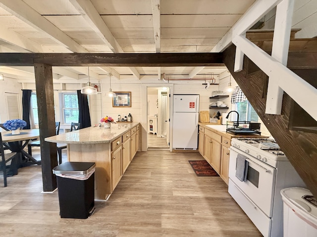 628 Springy Pond Rd, Otis, ME 04605 - kitchen with white appliances, light brown cabinets, a peninsula, light wood-style floors, and beamed ceiling