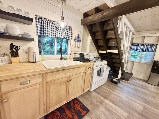 628 Springy Pond Rd, Otis, ME 04605 - kitchen featuring white range with gas stovetop, wood counters, light brown cabinetry, open shelves, and light wood finished floors