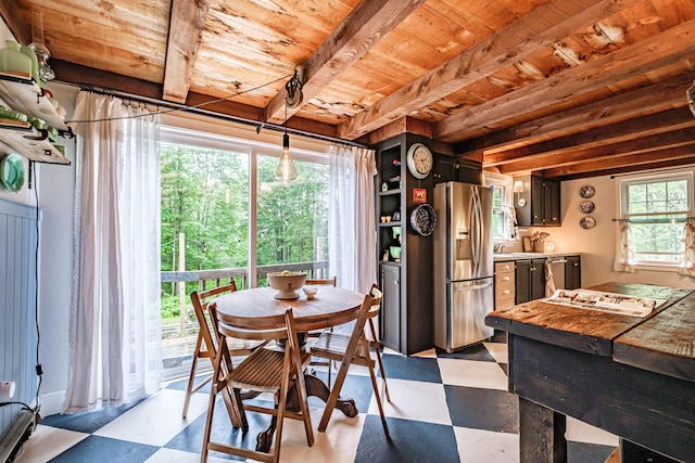 860 Gardiner Rd, Wiscasset, ME 04578 - dining space with light floors and a wood ceiling with exposed beams