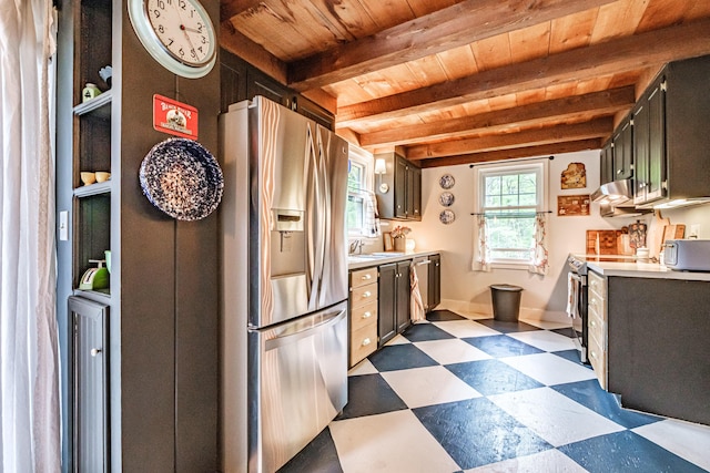 860 Gardiner Rd, Wiscasset, ME 04578 - kitchen featuring stainless steel refrigerator with ice dispenser, dark floors, range, light countertops, and a wooden ceiling with exposed beams
