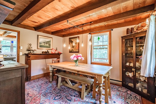 860 Gardiner Rd, Wiscasset, ME 04578 - dining room with a wooden ceiling with exposed beams, healthy amount of natural light, and a baseboard heating unit