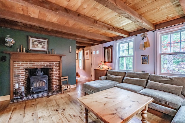 860 Gardiner Rd, Wiscasset, ME 04578 - living area featuring a wooden ceiling with exposed beams, hardwood / wood-style flooring, and a wood stove