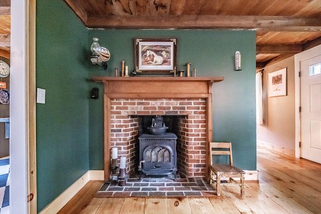860 Gardiner Rd, Wiscasset, ME 04578 - detailed view of a wooden ceiling with exposed beams, wood finished floors, and a wood stove
