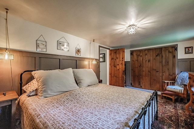 860 Gardiner Rd, Wiscasset, ME 04578 - bedroom with wainscoting and a decorative wall
