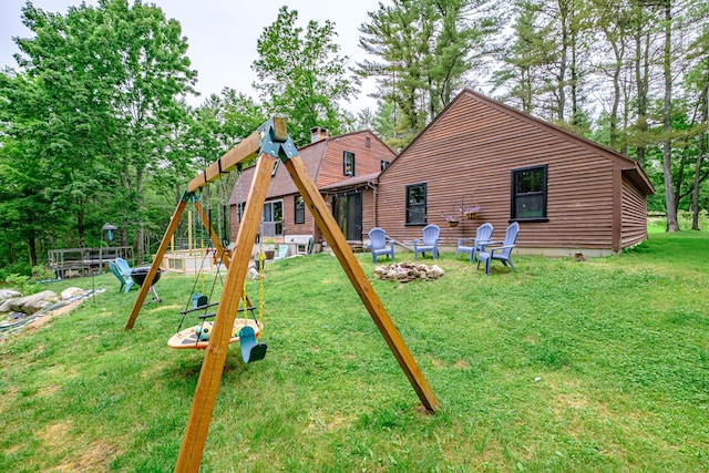860 Gardiner Rd, Wiscasset, ME 04578 - view of jungle gym with an outdoor fire pit and a lawn