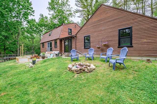860 Gardiner Rd, Wiscasset, ME 04578 - back of property with an outdoor fire pit