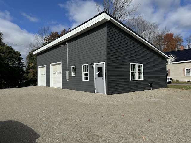 159 N St, Calais, ME 04619 - view of side of home with a garage and driveway