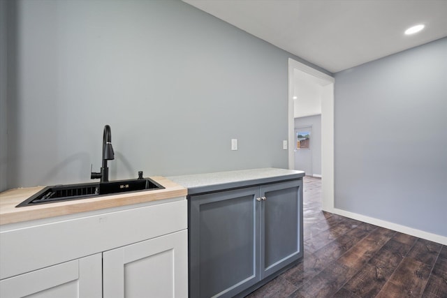159 N St, Calais, ME 04619 - kitchen with dark wood-type flooring, light countertops, and recessed lighting