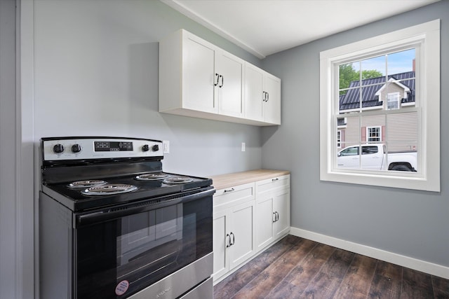 159 N St, Calais, ME 04619 - kitchen with range with electric cooktop, dark wood-style flooring, light countertops, and white cabinetry