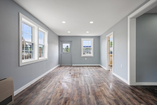 159 N St, Calais, ME 04619 - spare room with wood finished floors, recessed lighting, and heating unit