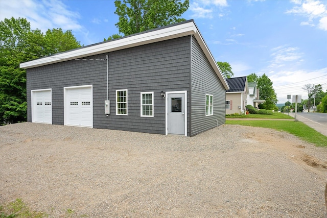 159 N St, Calais, ME 04619 - garage with gravel driveway