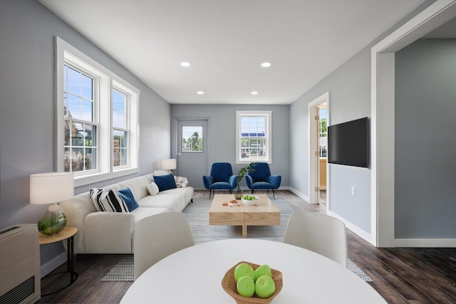 159 N St, Calais, ME 04619 - living area with recessed lighting, wood finished floors, and heating unit