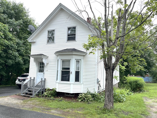 6 Autumn St, Lisbon, ME 04252 - view of front of home featuring a chimney and entry steps