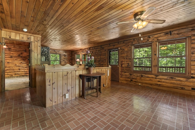 31 Convene Rd, Sebago, ME 04029 - kitchen with healthy amount of natural light, brick flooring, a ceiling fan, wood ceiling, and wood walls