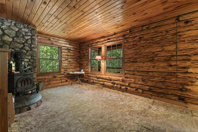 31 Convene Rd, Sebago, ME 04029 - unfurnished living room featuring a wood stove, log walls, carpet floors, and wood ceiling