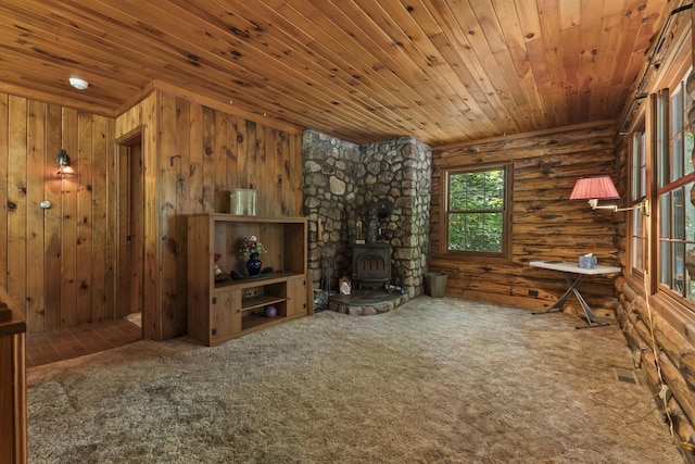 31 Convene Rd, Sebago, ME 04029 - unfurnished living room featuring wood ceiling, a wood stove, carpet, and log walls