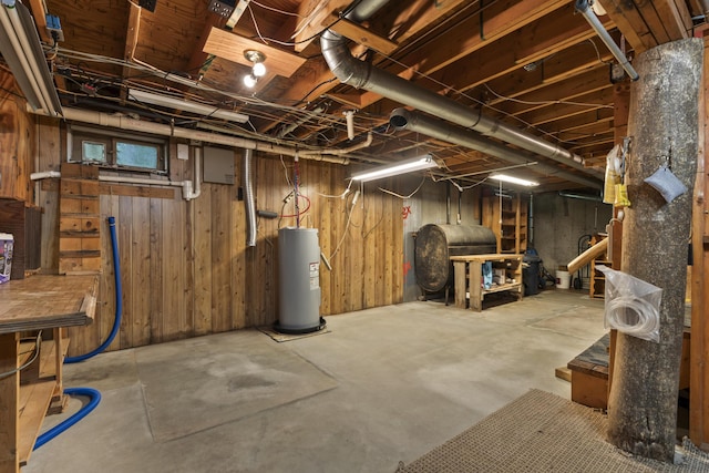 31 Convene Rd, Sebago, ME 04029 - unfinished below grade area featuring heating fuel, water heater, and wooden walls