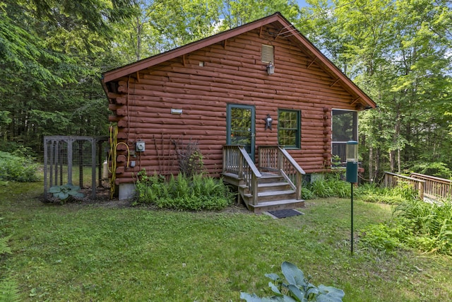 31 Convene Rd, Sebago, ME 04029 - rear view of property with log siding and a lawn