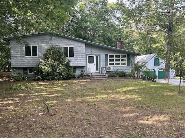 106 Bowdoinham Rd, Sabattus, ME 04280 - tri-level home with a chimney and a front lawn
