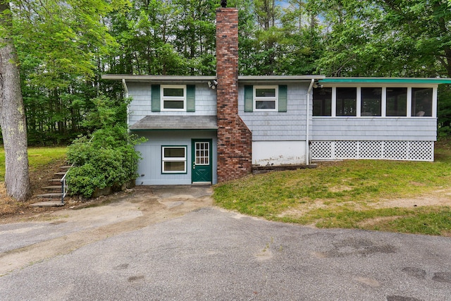 106 Bowdoinham Rd, Sabattus, ME 04280 - view of front of property featuring a chimney and a sunroom