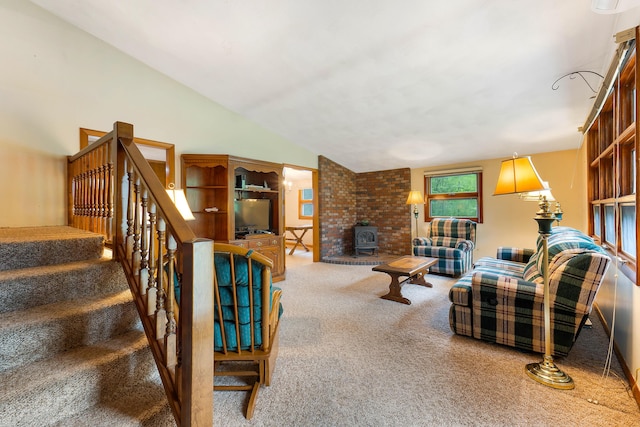 106 Bowdoinham Rd, Sabattus, ME 04280 - carpeted living area featuring vaulted ceiling, a wood stove, and stairway