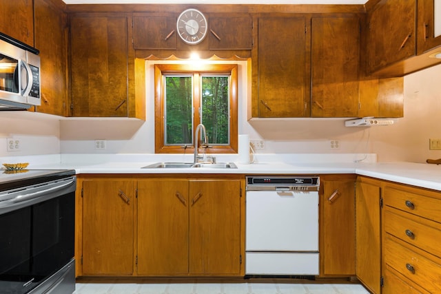 106 Bowdoinham Rd, Sabattus, ME 04280 - kitchen featuring stainless steel appliances, light countertops, and brown cabinets