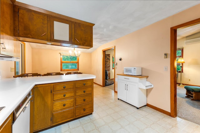 106 Bowdoinham Rd, Sabattus, ME 04280 - kitchen with white appliances, light flooring, light countertops, and a peninsula